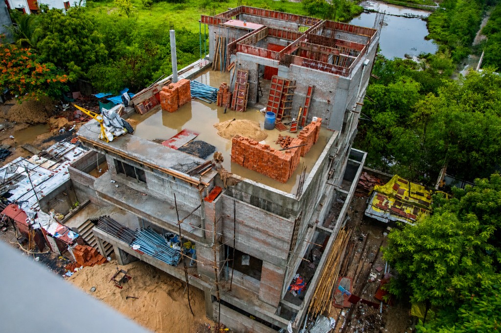 Civil Contracting - Aerial view of multi-storey civil construction site with brickwork and RCC structure